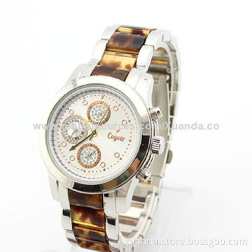 Football star wristwatch with power function, resin and metal match strap, metal case